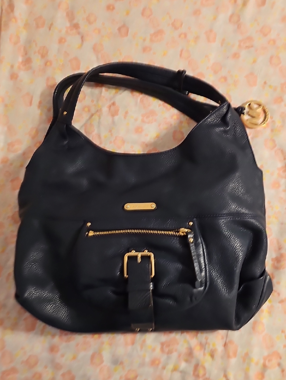 Michael Kors Navy Blue pebbled leather hobo shoulder bag w/ a gold-tone buckle.